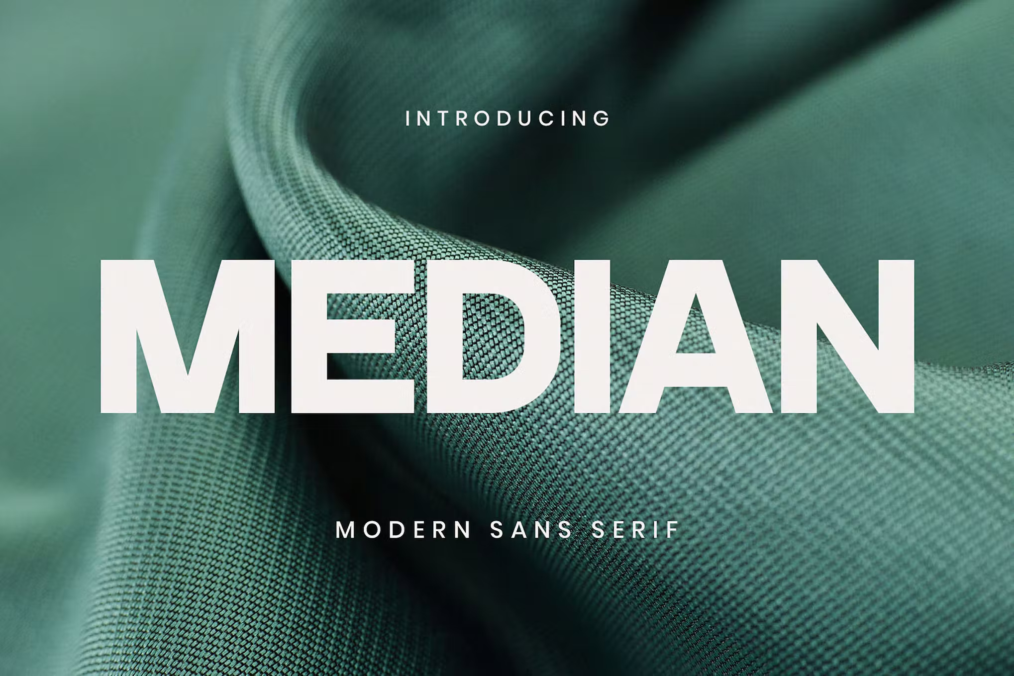 Popular font Median on a background of green fabric. 