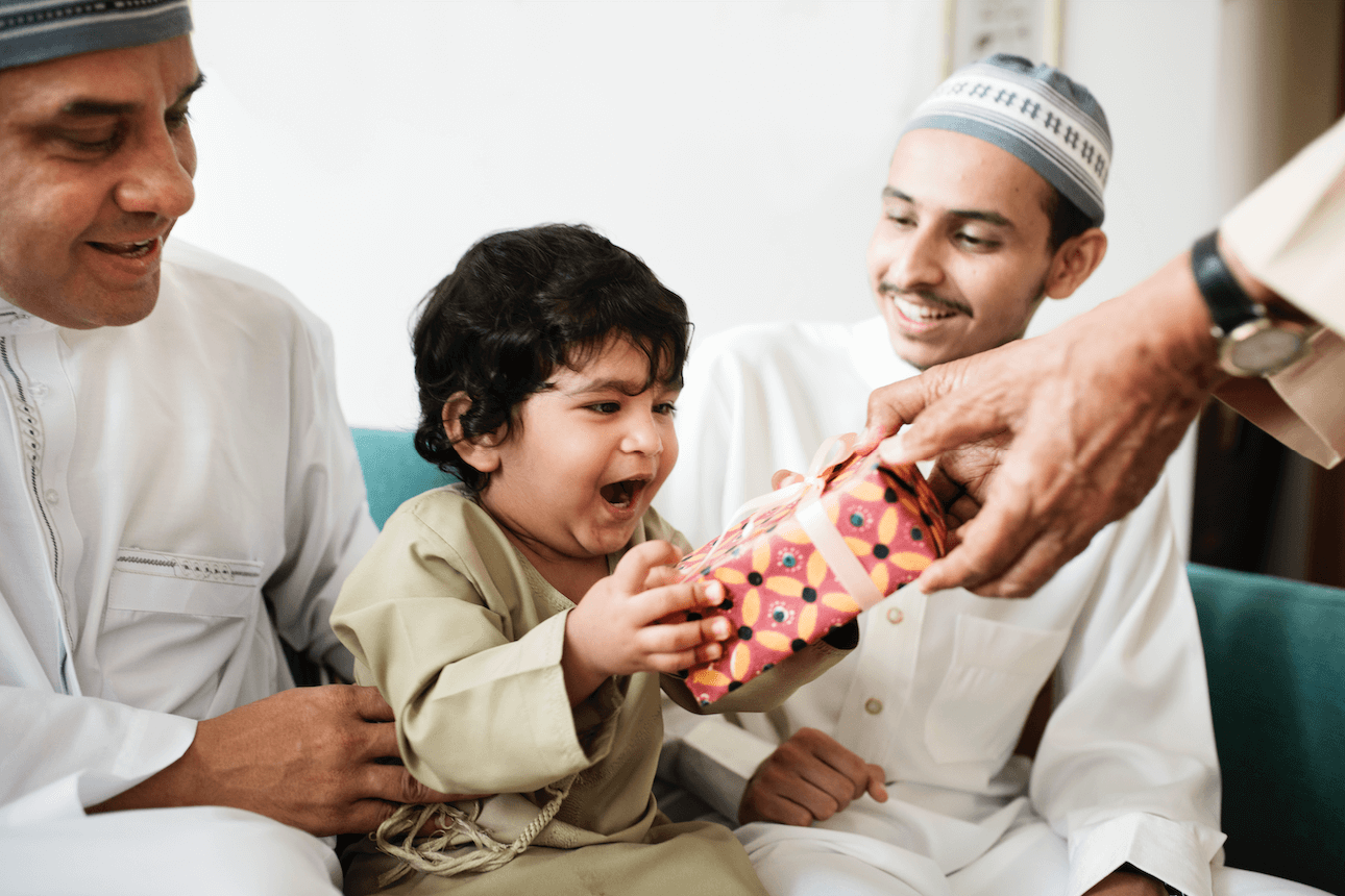 Muslim family with a child getting a gift